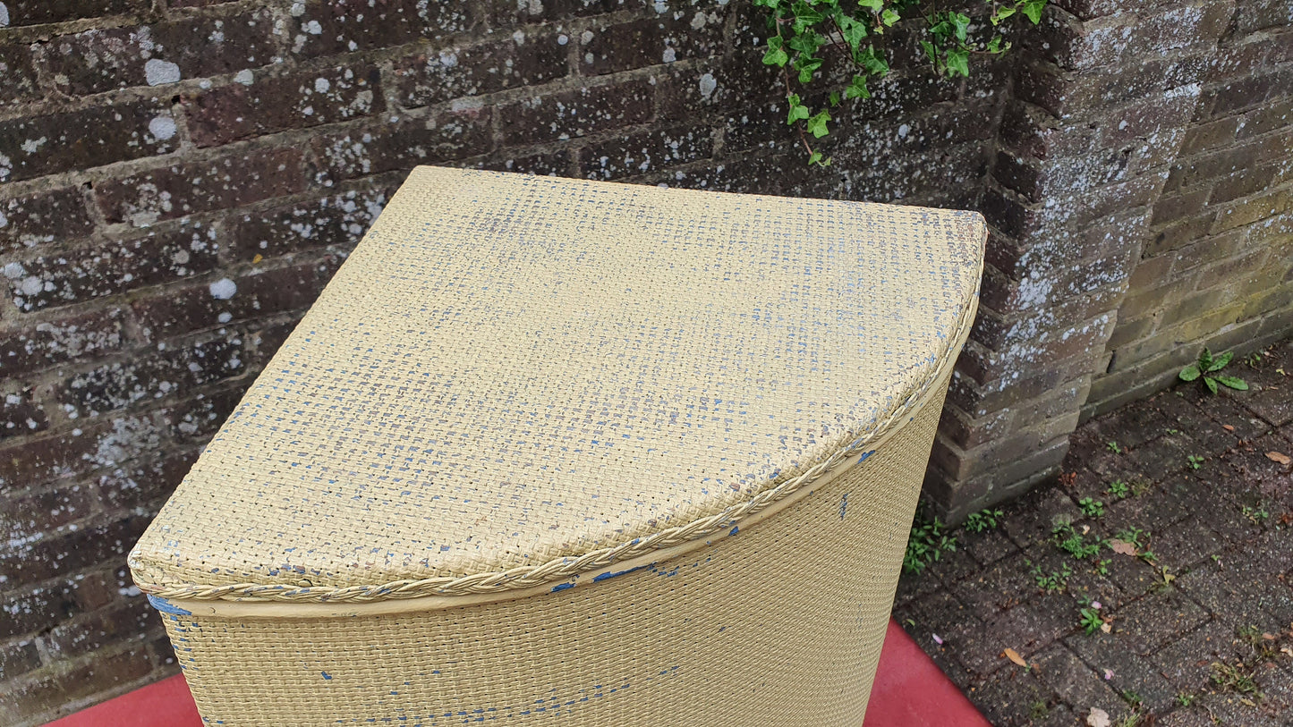 Painted Lloyd Loom Style Yellow Painted Corner Linen Basket.