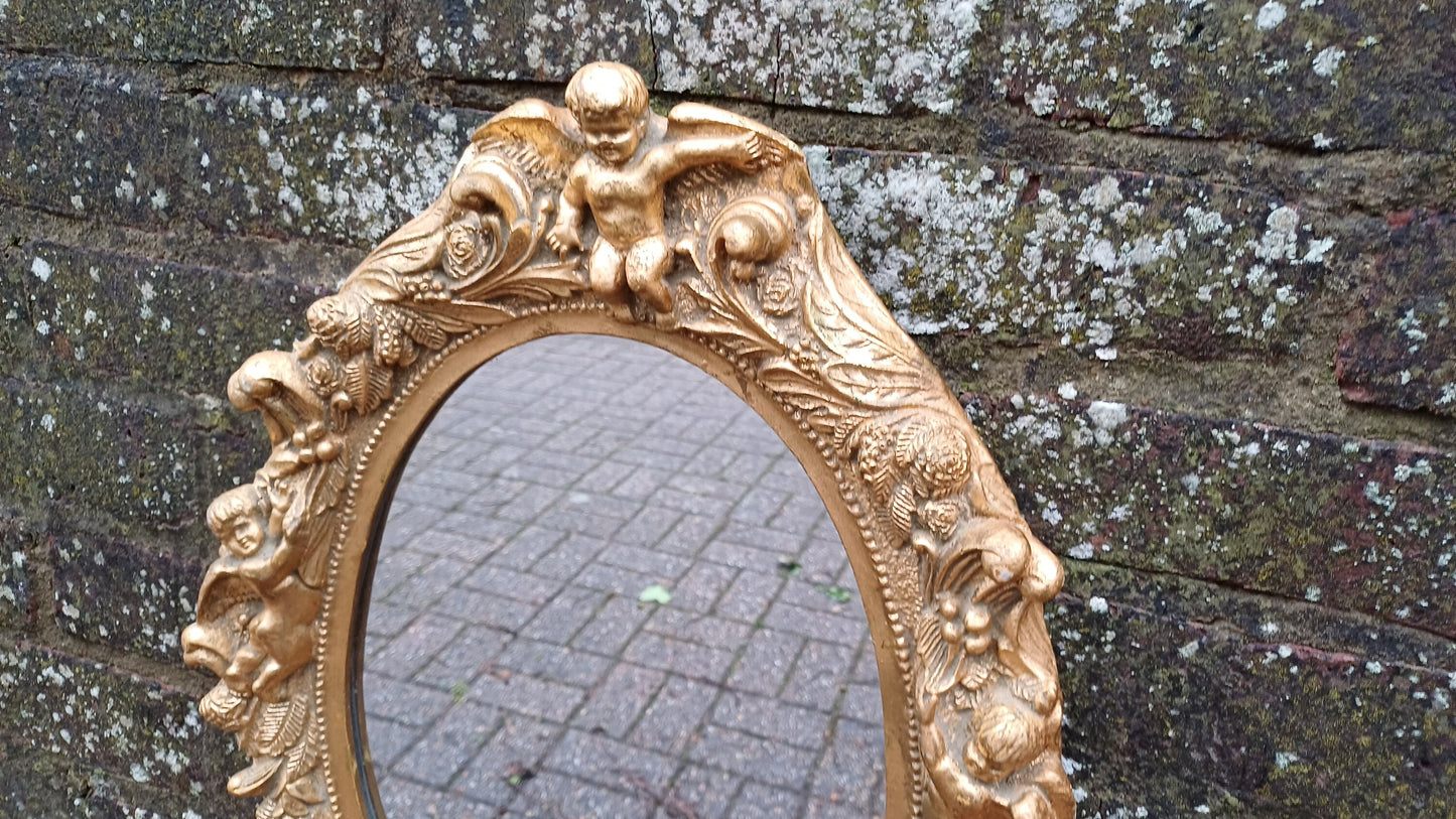Vintage Composite Cherub Gold Gilt Decorative Mirror.