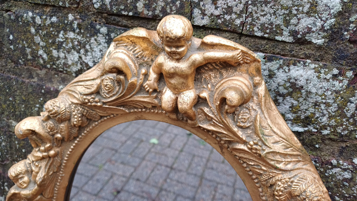 Vintage Composite Cherub Gold Gilt Decorative Mirror.