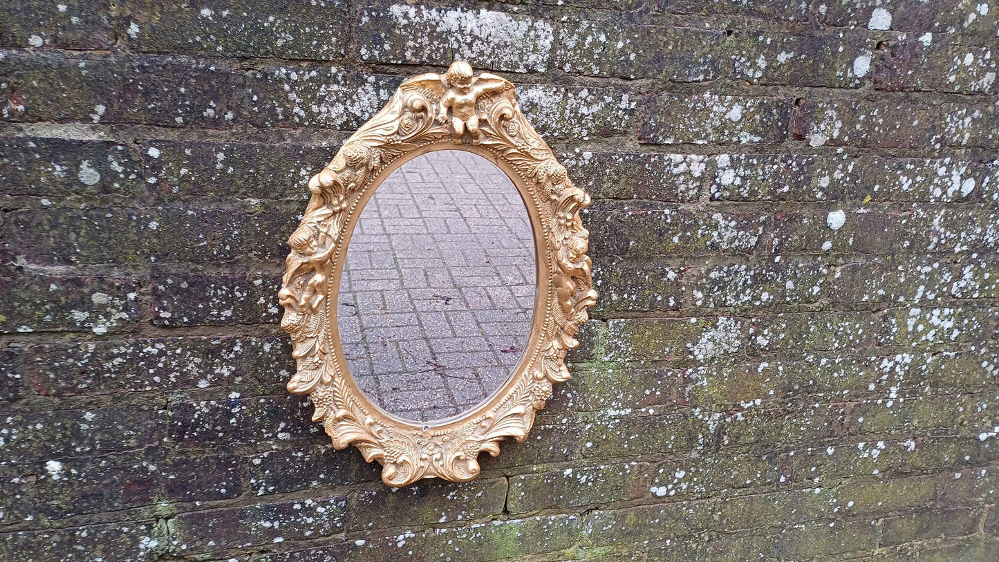 Vintage Composite Cherub Gold Gilt Decorative Mirror.