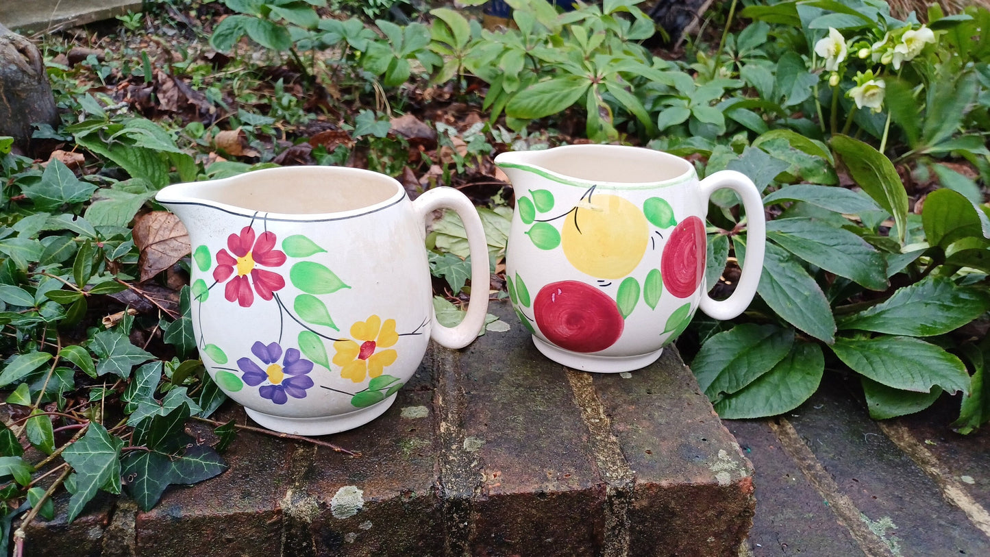 pottery jugs; floral jug, apples jug, kitchen jugs