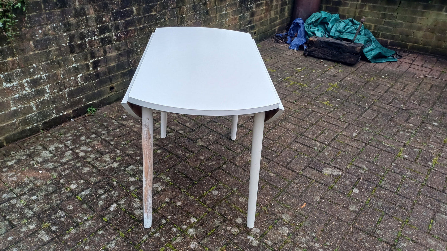 Classic Vintage retro 70s Dining Kitchen Table White Formica Top and Wooden Legs. Legs are detachable for access. 'Dinette'. Drop Leaf.