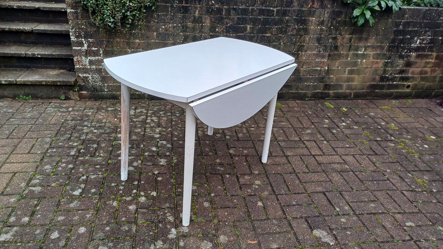 Classic Vintage retro 70s Dining Kitchen Table White Formica Top and Wooden Legs. Legs are detachable for access. 'Dinette'. Drop Leaf.
