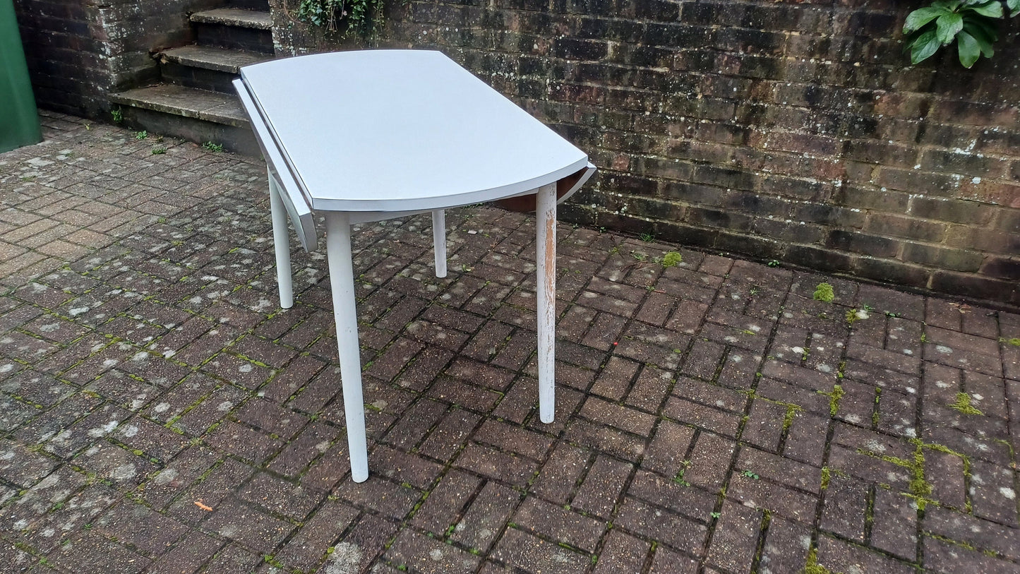 Classic Vintage retro 70s Dining Kitchen Table White Formica Top and Wooden Legs. Legs are detachable for access. 'Dinette'. Drop Leaf.