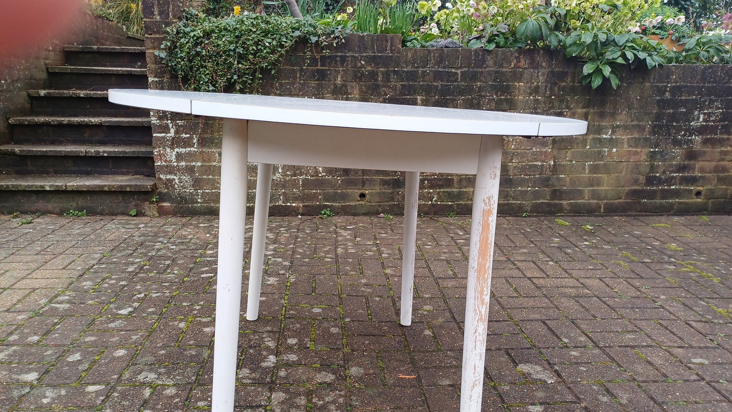 Classic Vintage retro 70s Dining Kitchen Table White Formica Top and Wooden Legs. Legs are detachable for access. 'Dinette'. Drop Leaf.