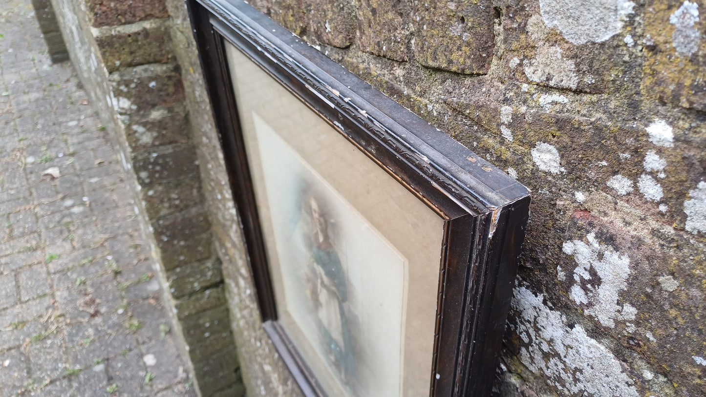 Vintage photo sepia of young woman, in dark wood vintage glazed frame
