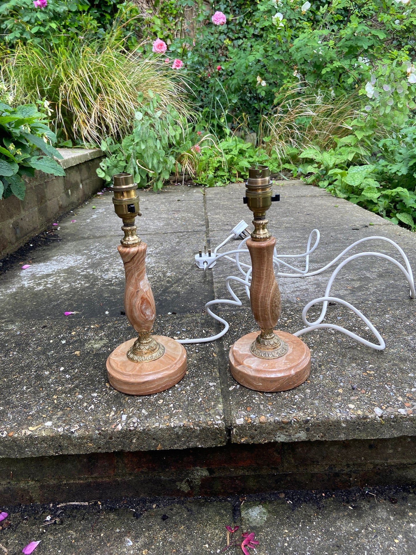 pair of brown and cream onyx lamps; vintage onyx lamps, they have metal detail onteh stem and where the stem meets th base; they are working; they have good length of whiteflex.