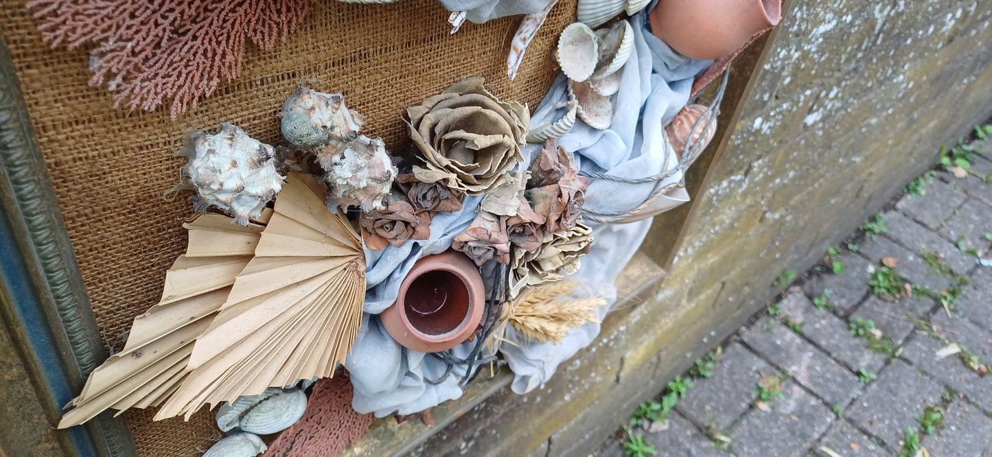 Stunning piece of 3D craft/ collage - real shells, coral, material, plants all displayed on a hessian backing in a upcycled vintage frame