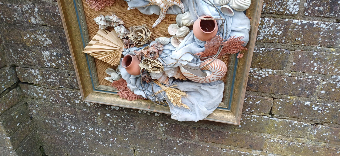 Stunning piece of 3D craft/ collage - real shells, coral, material, plants all displayed on a hessian backing in a upcycled vintage frame