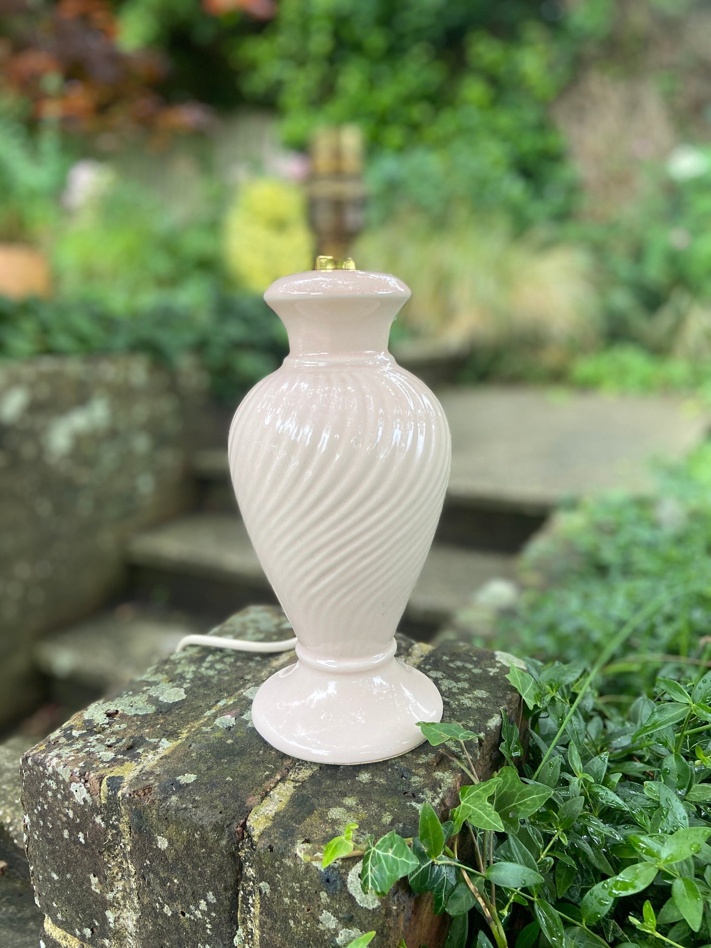 pale pink goodson lamp light. lovely ceramic lamp. pink is very subtle. spiral pattern on the body of the lamp. great condition. working
