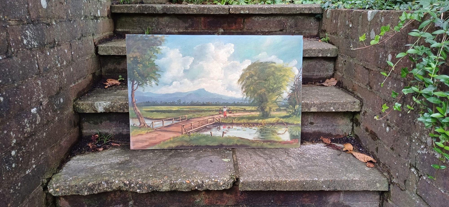 original asian oil painting. painted by Yusoff Abdullah. Contemporary post war Malaysian artist. This painting is a rural scene of a farmer/villager carrying goods across a field. Mountains in the background. 1960s oil painting