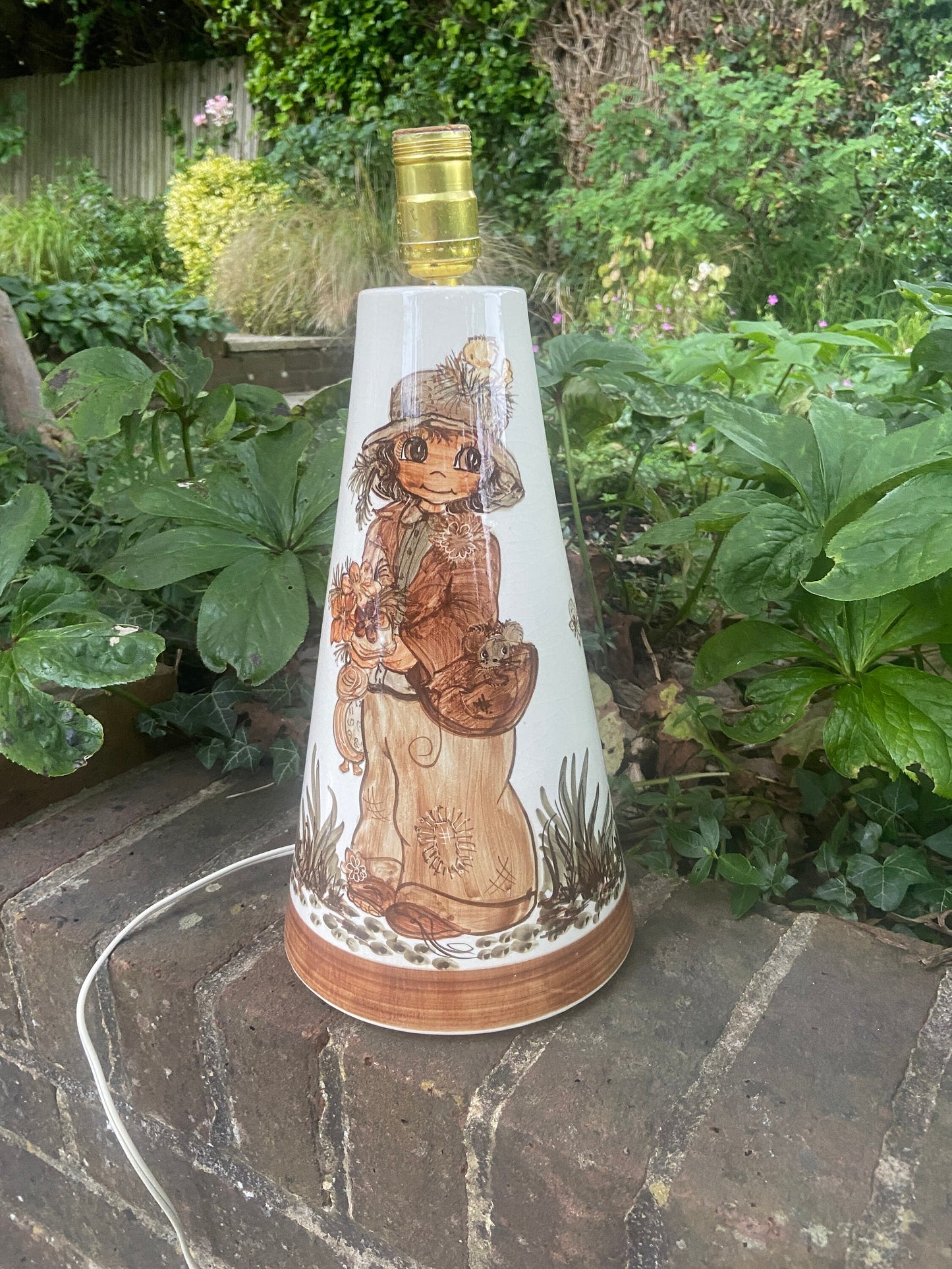 jersey pottery wide eyed boy hand painted on a retro lamp. large working table lamp. browns and beiges
