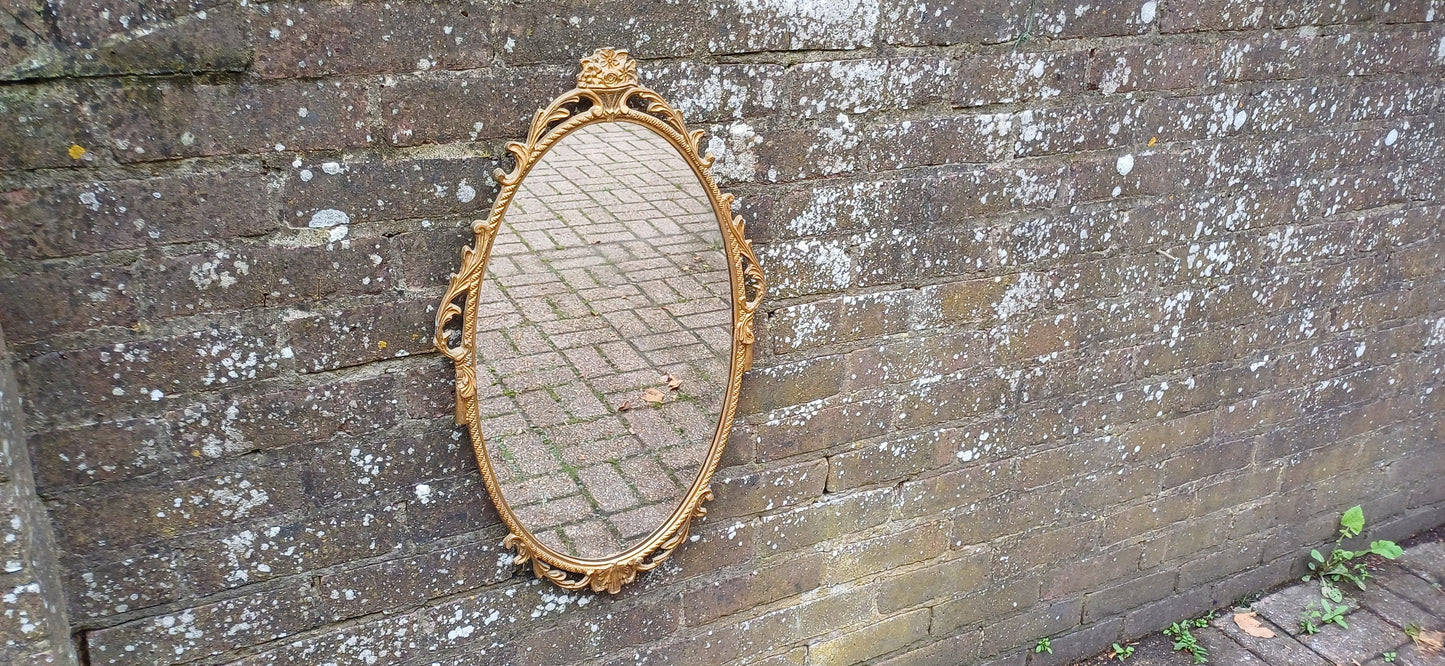 Beautiful Vintage 80s or 90s Ornate Oval Metal Gold Italian Style Wall Mirror Flower in Basket Decoration