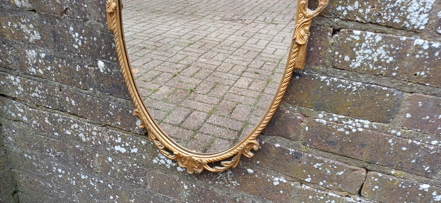 Beautiful Vintage 80s or 90s Ornate Oval Metal Gold Italian Style Wall Mirror Flower in Basket Decoration