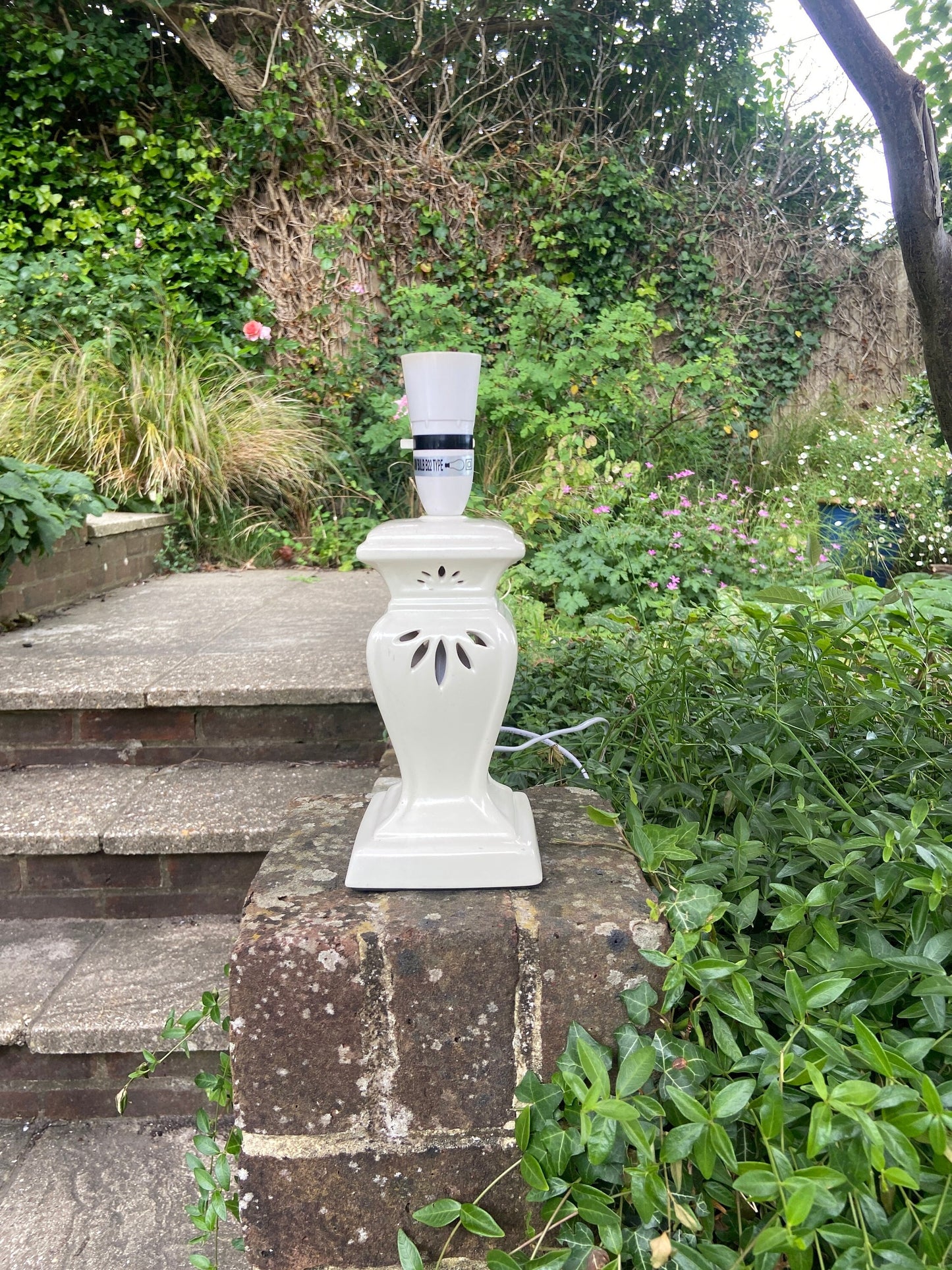 a lantern style vintage table lamp. ceramic with a glaze. not very old so wiring all up to date. attractive style. very good condition.