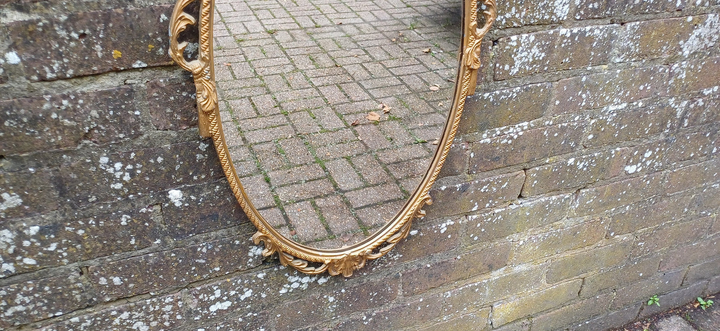 Beautiful Vintage 80s or 90s Ornate Oval Metal Gold Italian Style Wall Mirror Flower in Basket Decoration