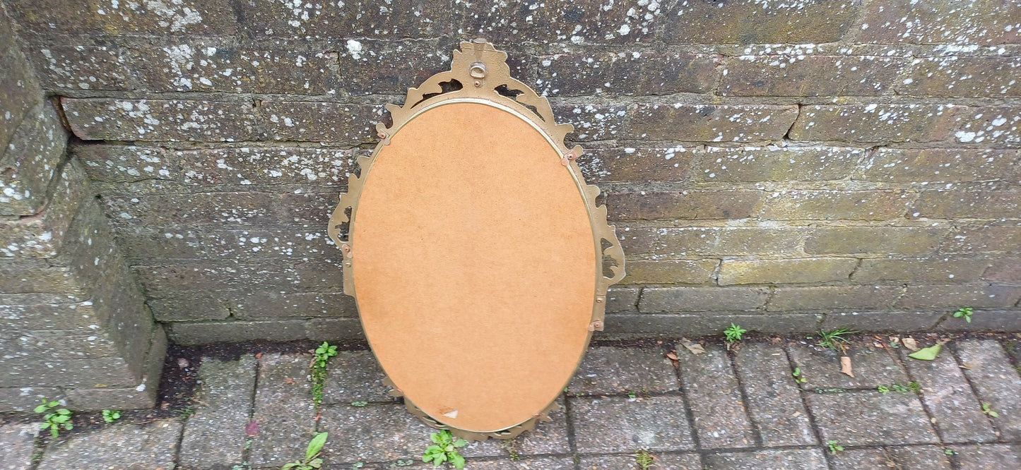 Beautiful Vintage 80s or 90s Ornate Oval Metal Gold Italian Style Wall Mirror Flower in Basket Decoration