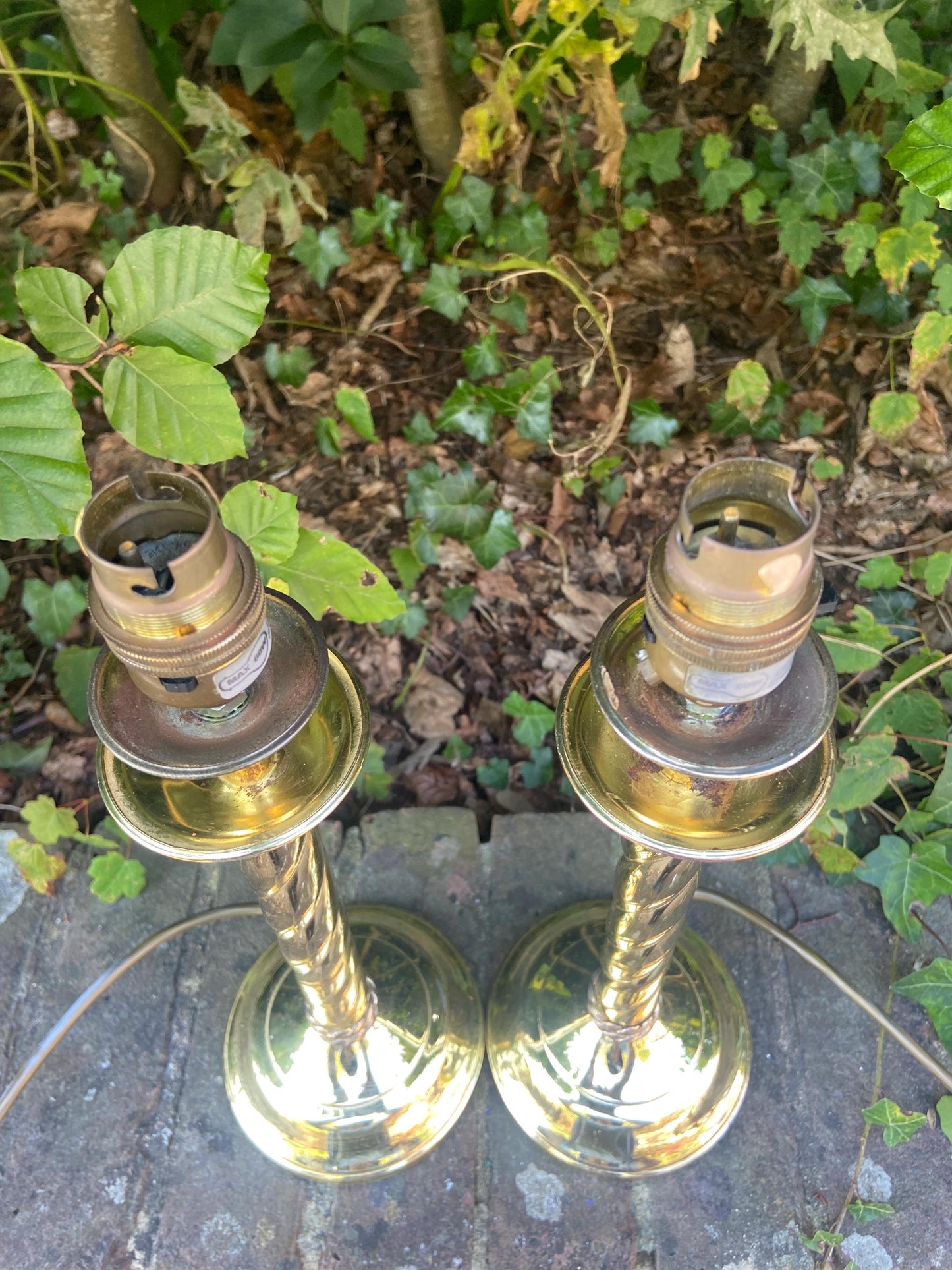 Pair of vintage candlestick style shiny brass table lamps with swirled ribbon design - working table lamps
