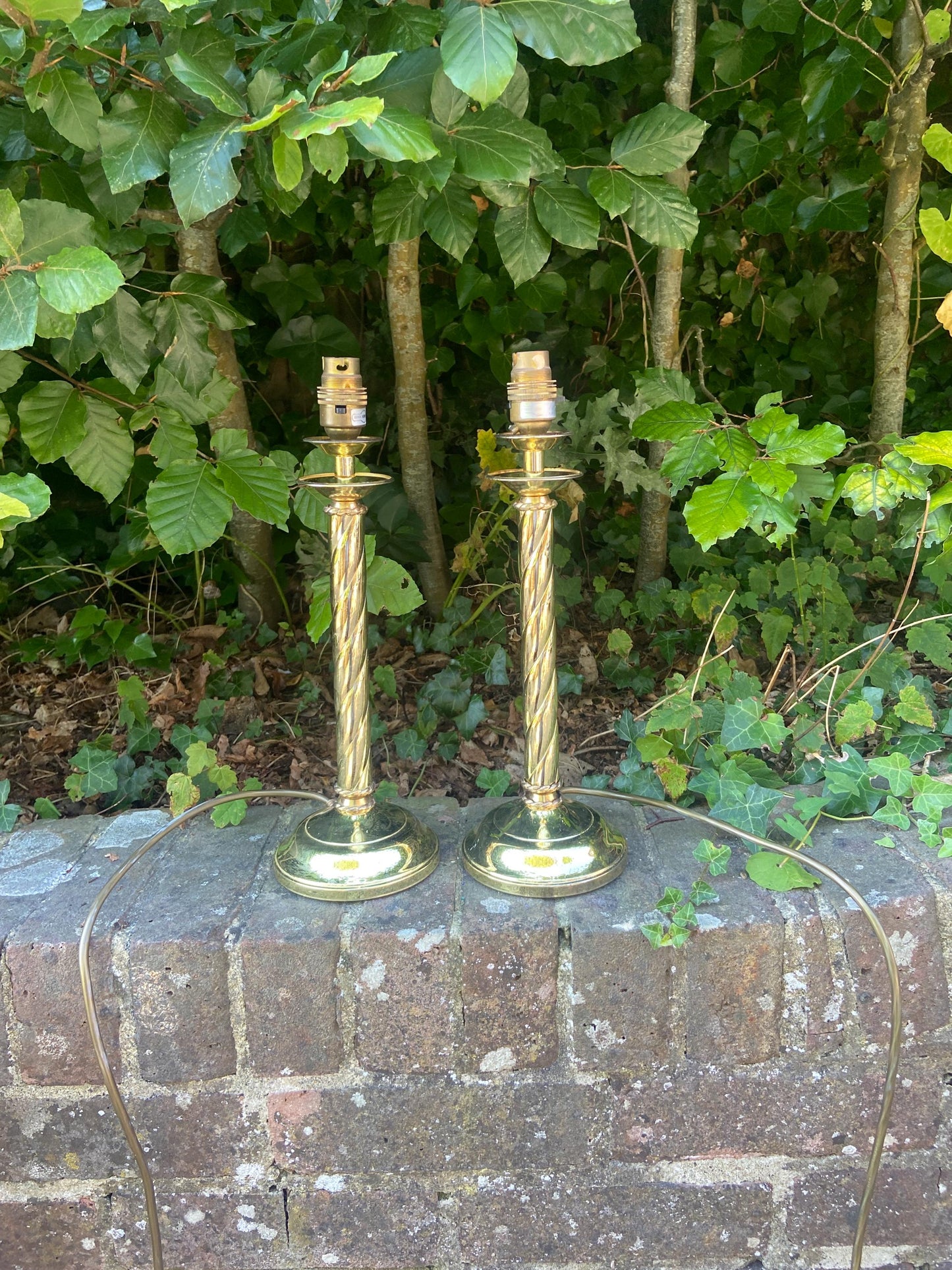 Pair of vintage candlestick style shiny brass table lamps with swirled ribbon design - working table lamps