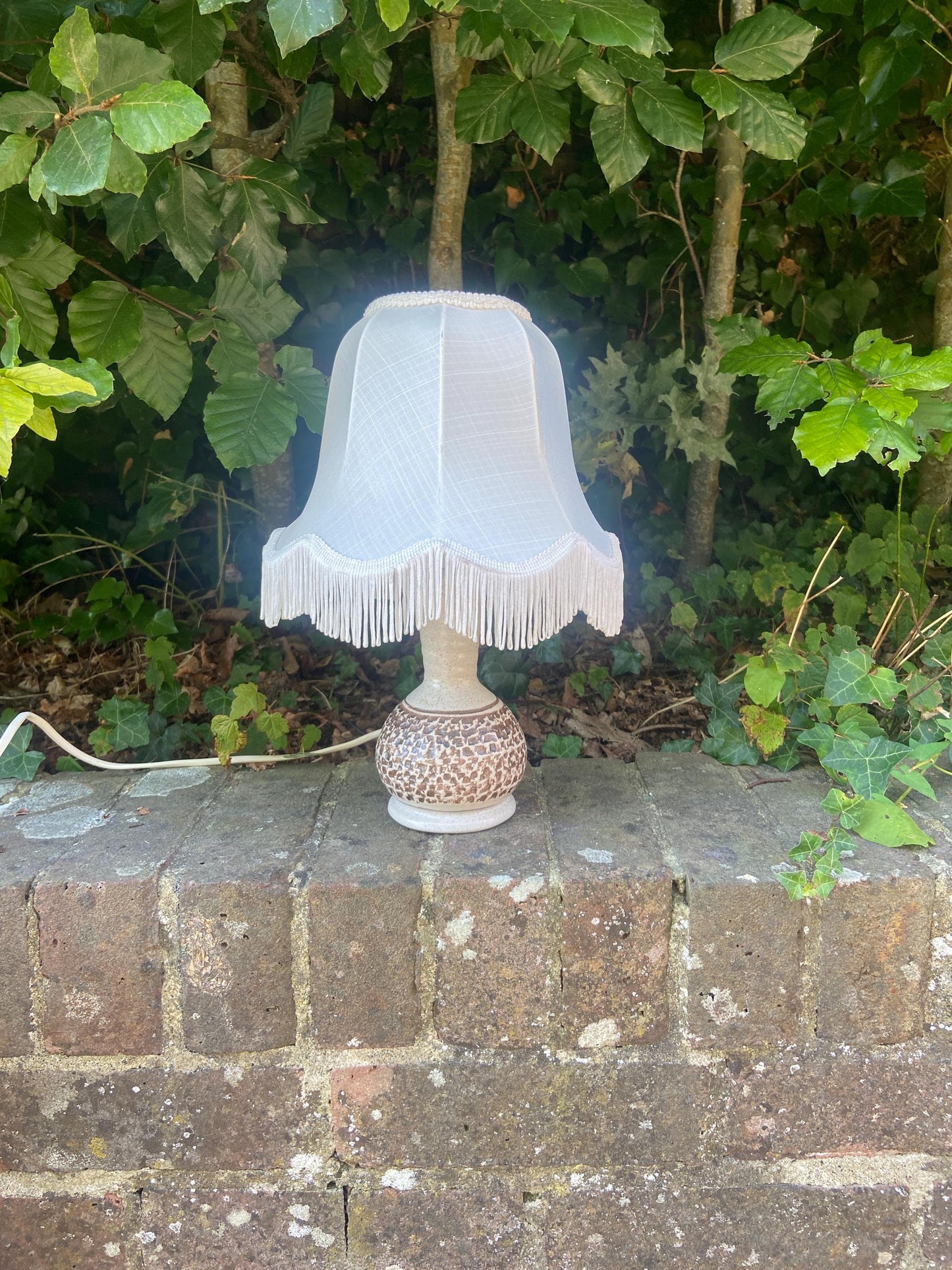 retro pottery lamp in cream and brown. handmade. working retro lamp. has a matching retro shade in cream