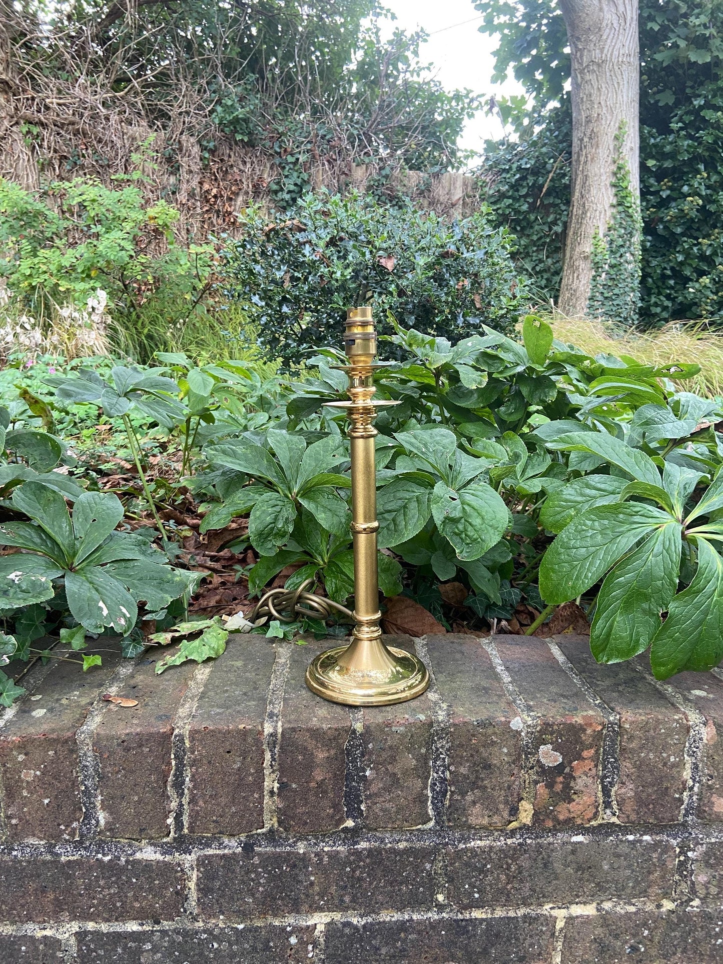 quality made in england brass lamp. lovely shape. two finishes on the stem. pat tested. heavy and classic table lamp, vintage lamp