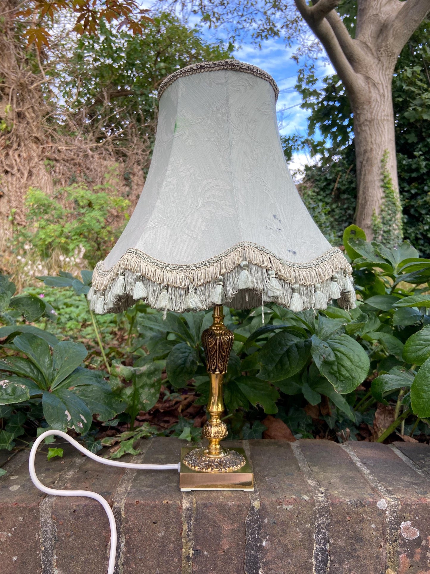 Vintage ornate brass lamp and authentic green vintage shade
