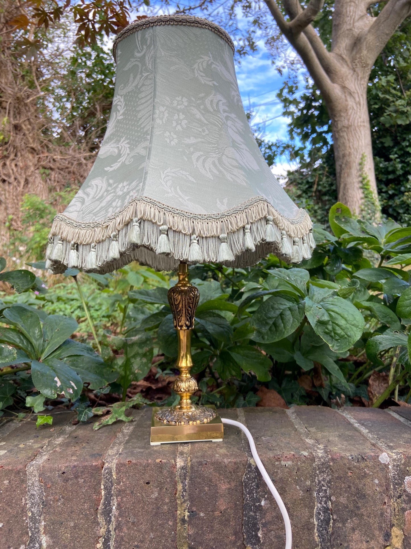 Vintage ornate brass lamp and authentic green vintage shade