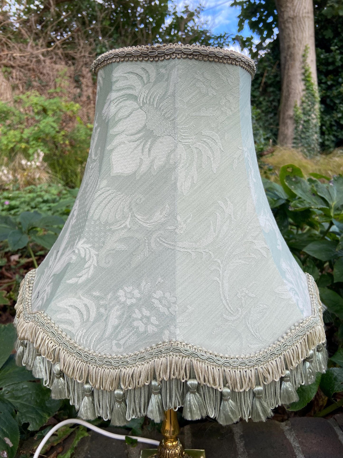 Vintage ornate brass lamp and authentic green vintage shade