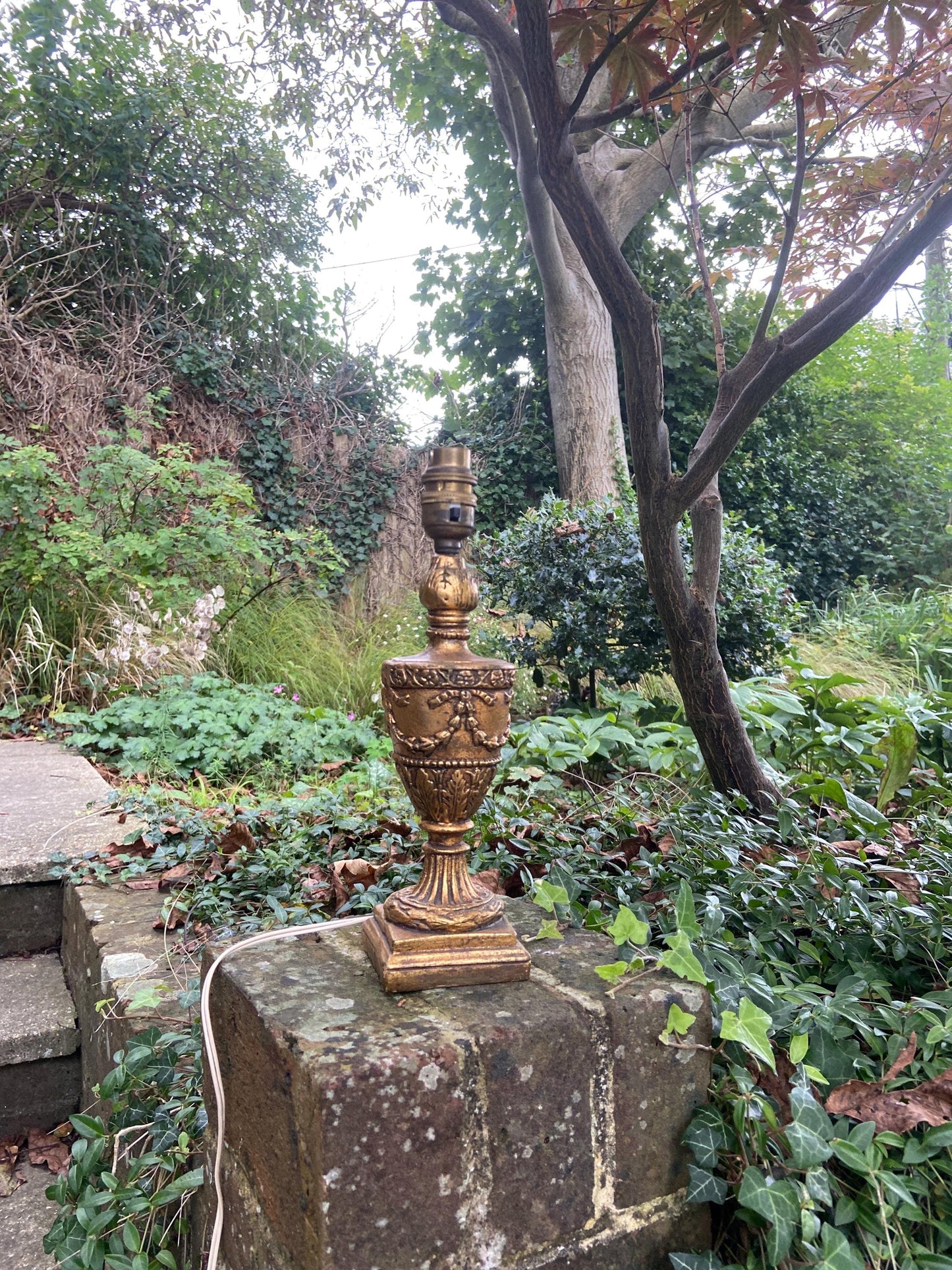 retro vintage wooden table lamp painted in antique gold finish. working condition. ornate decoration