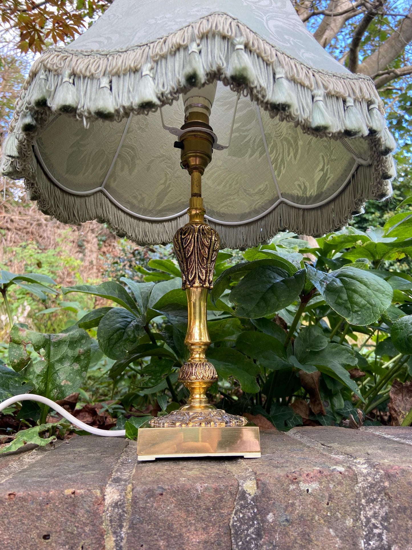 Vintage ornate brass lamp and authentic green vintage shade