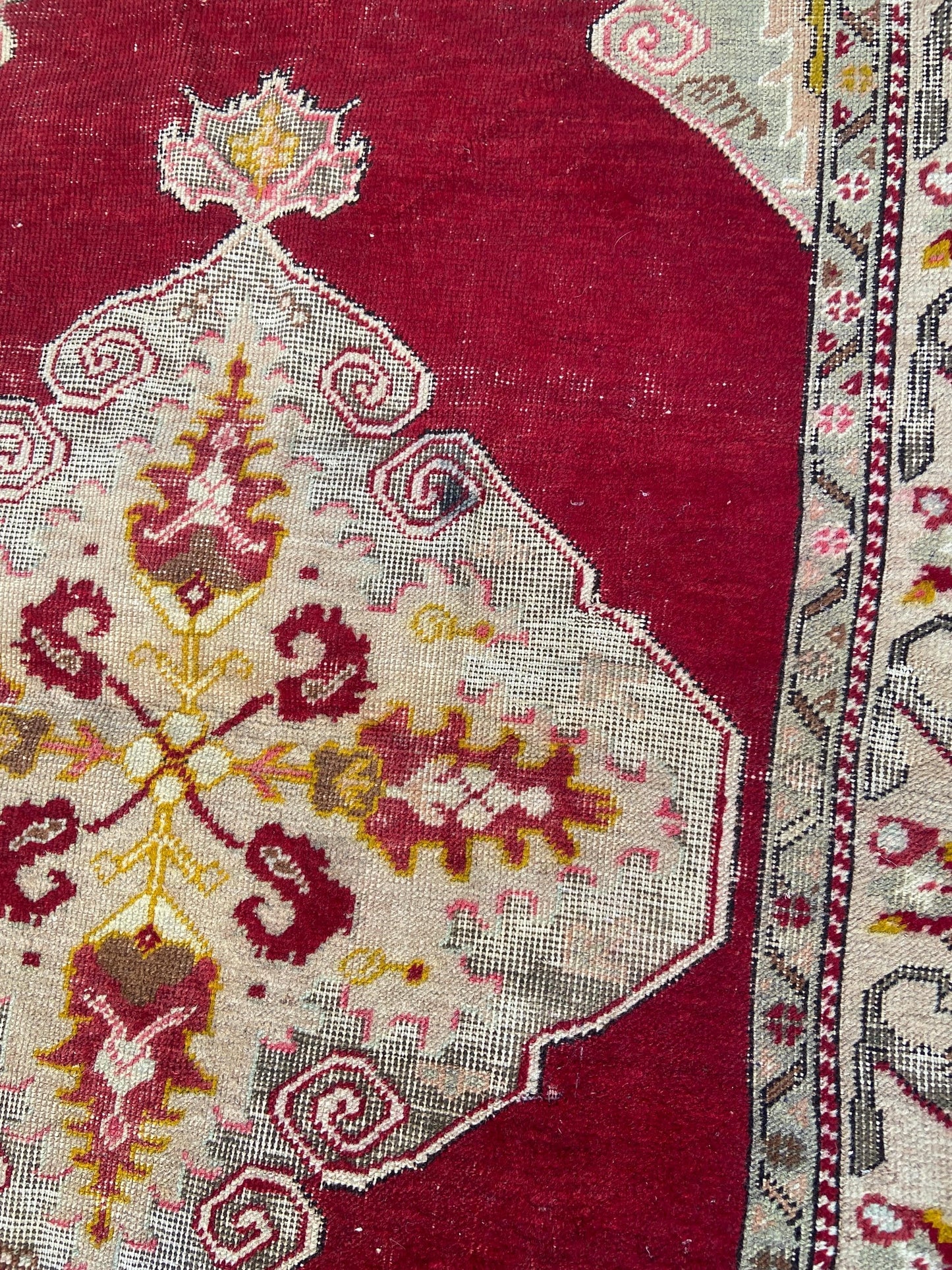 Vintage woollen rug, aged and charming, pinks reds golds (170cm x 106cm)