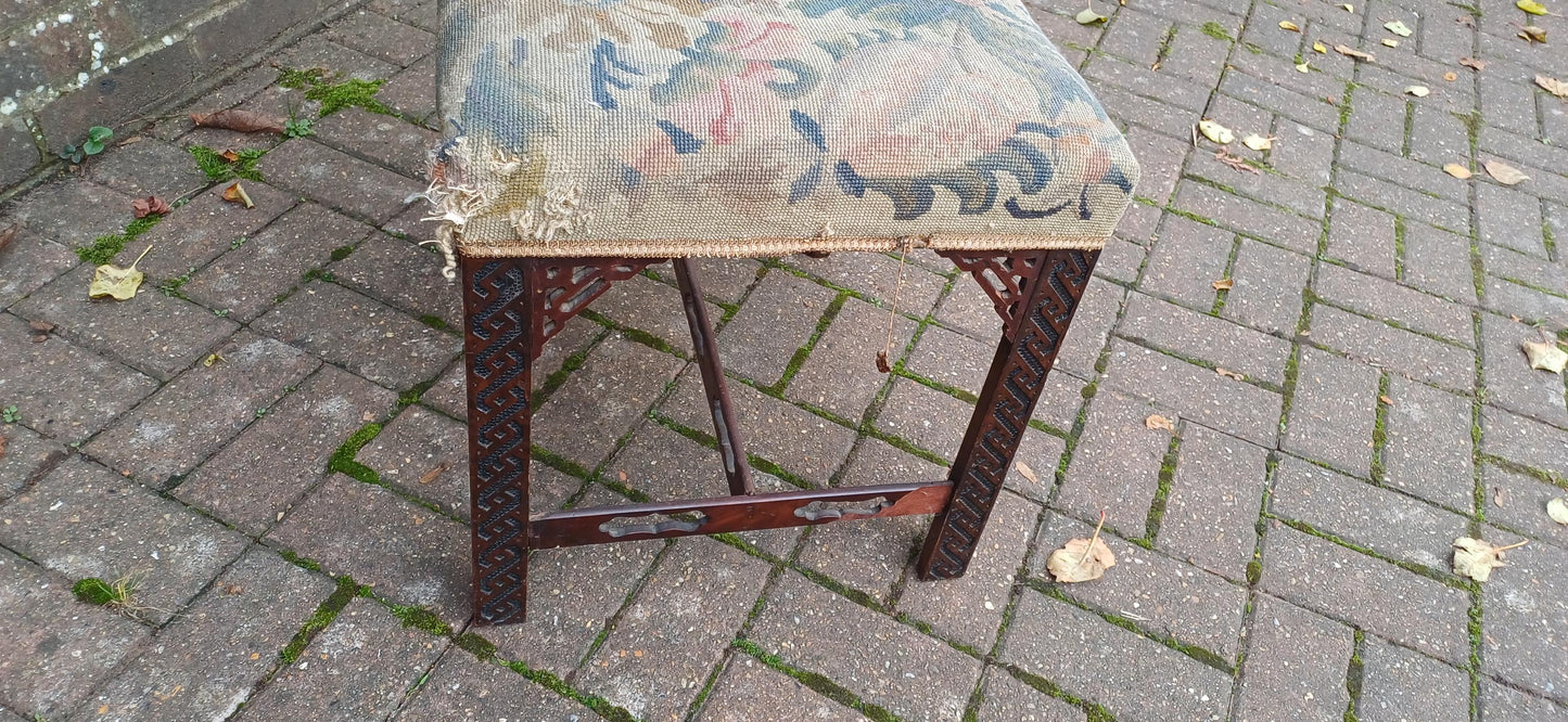 Antique Mahogany Stool with Tapestry Seat, Ornate Carved Details & Fretwork Accents – Elegant Vintage Vanity Piece Age Worn