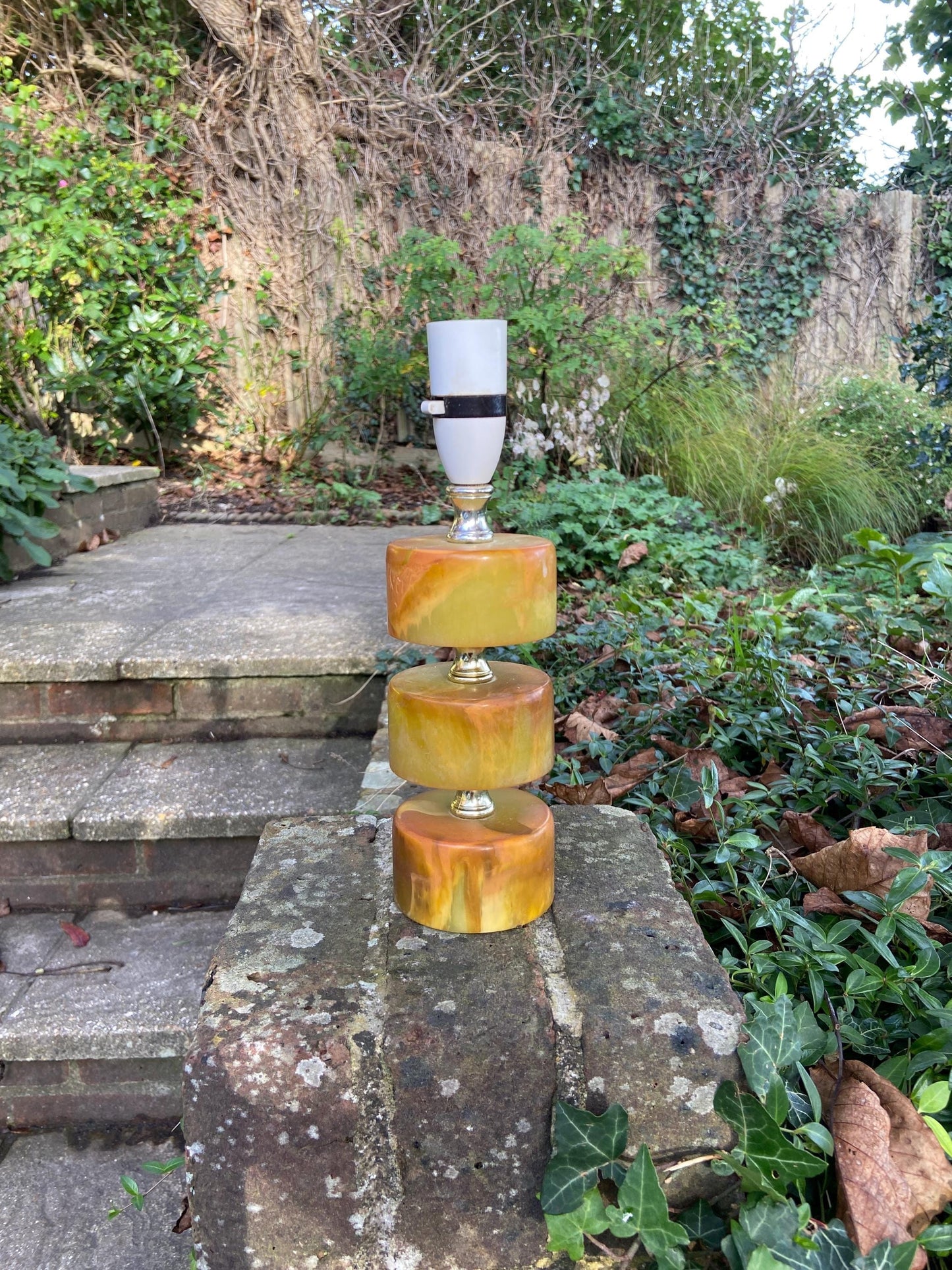wonderful 1970s retro table lamp. made out of resin but made to look like amber. excellent working condition