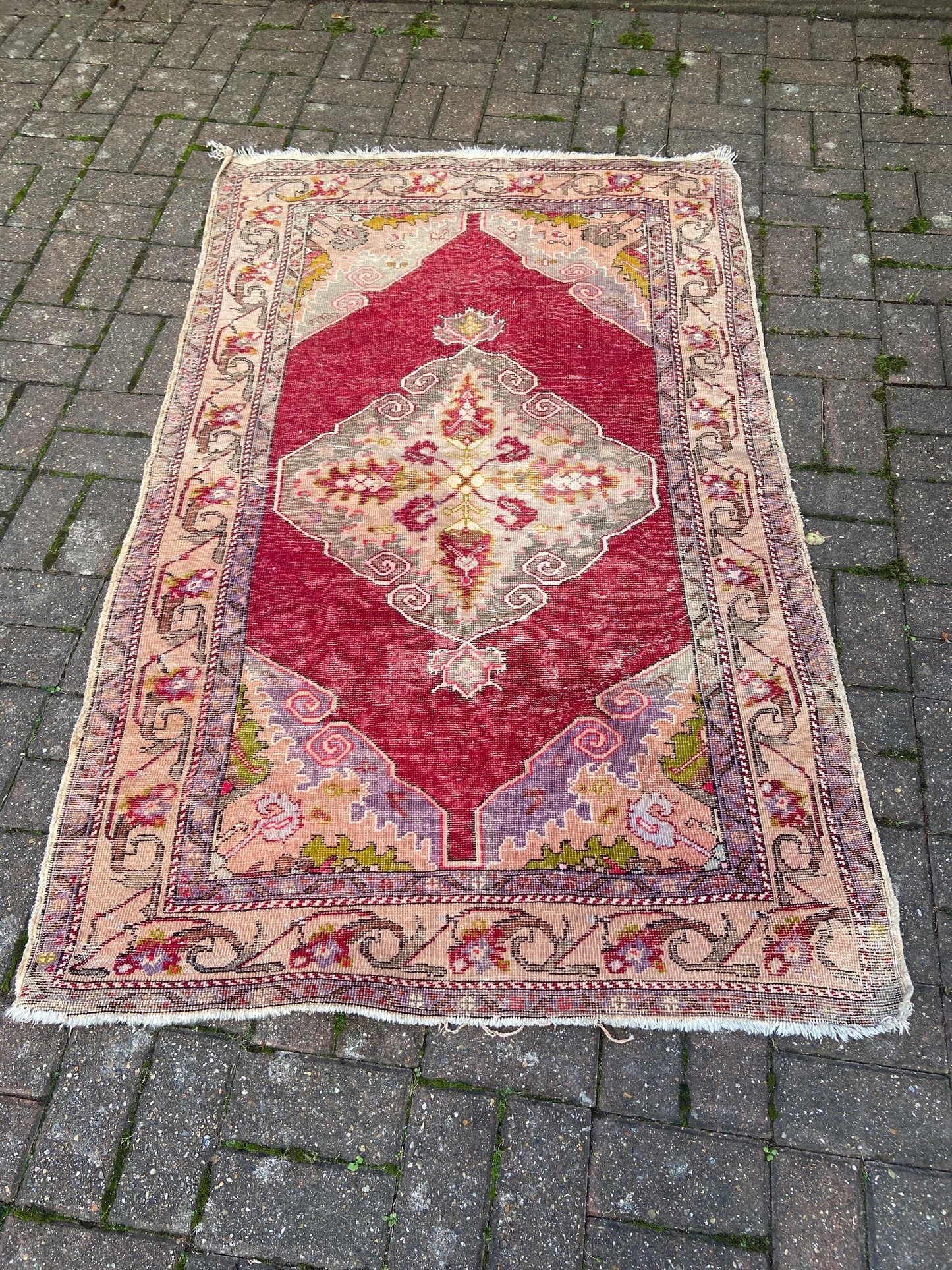 Vintage woollen rug, aged and charming, pinks reds golds (170cm x 106cm)
