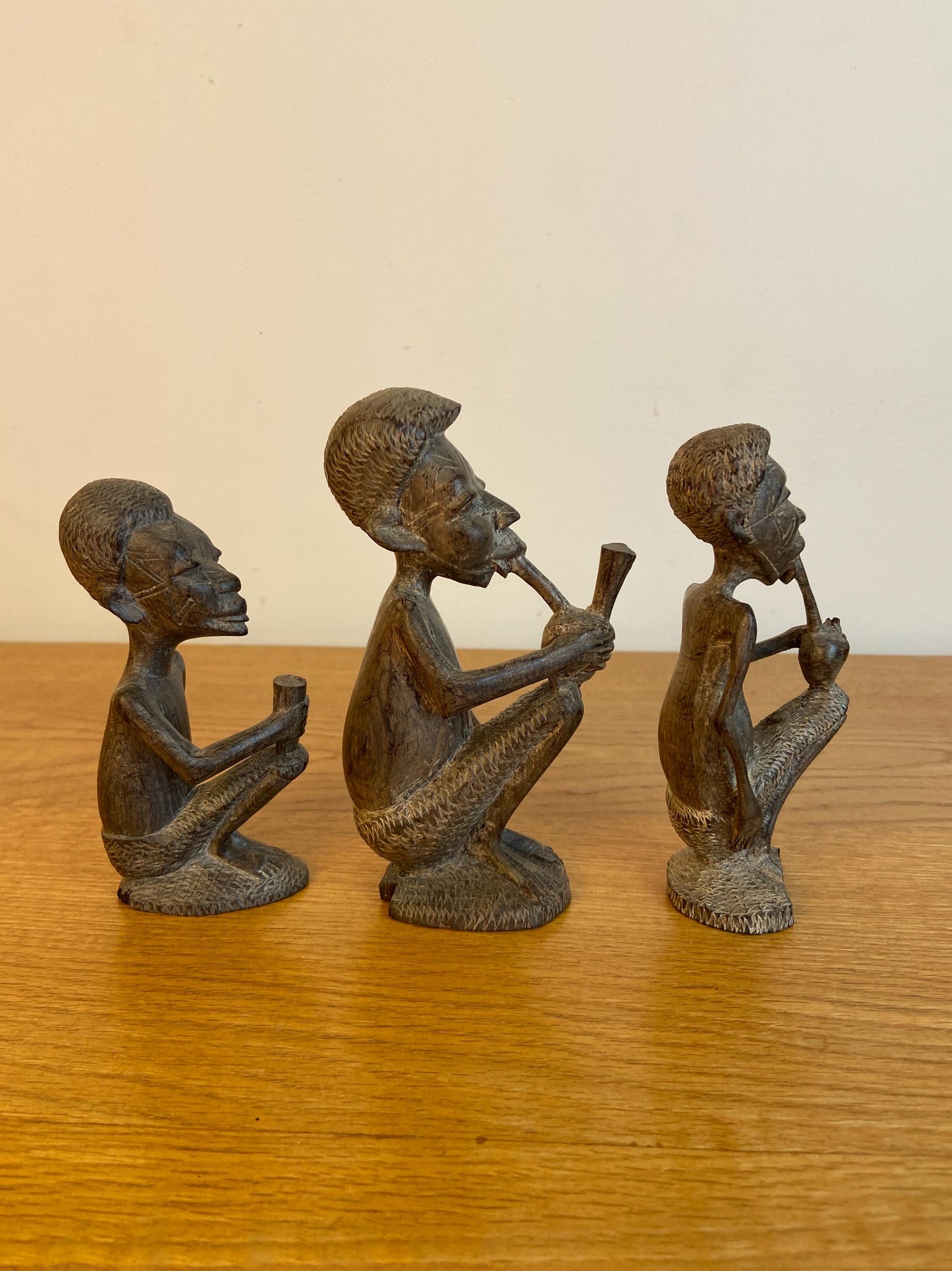 Three wonderful African carved wooden figurines, Traditional style Three Men carved out of wood