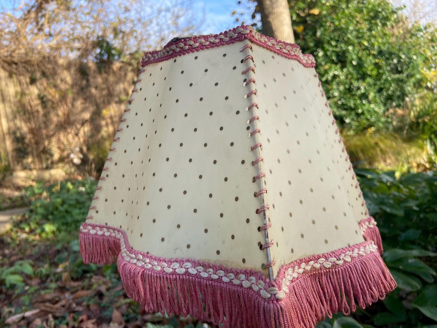 Vintage 1920s Cream Mica or Celluloid Table Lamp Shade with Gold Polka Dots, Pink Thread, and Fringe – unusual shape with Curved Sides