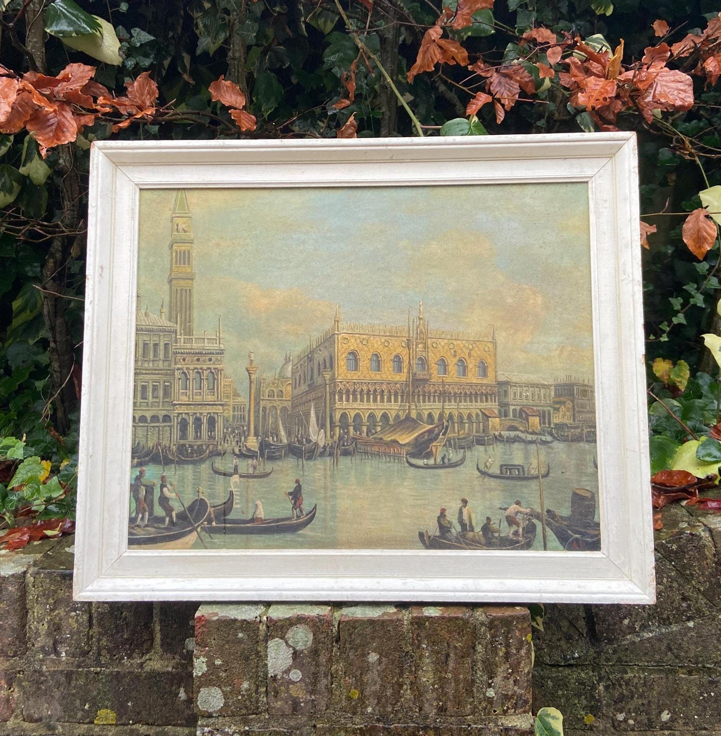 Excellent copy of one of Canalettos paintings. An oil on board, completed in the 1970s and framed in a retro white wooden frame.