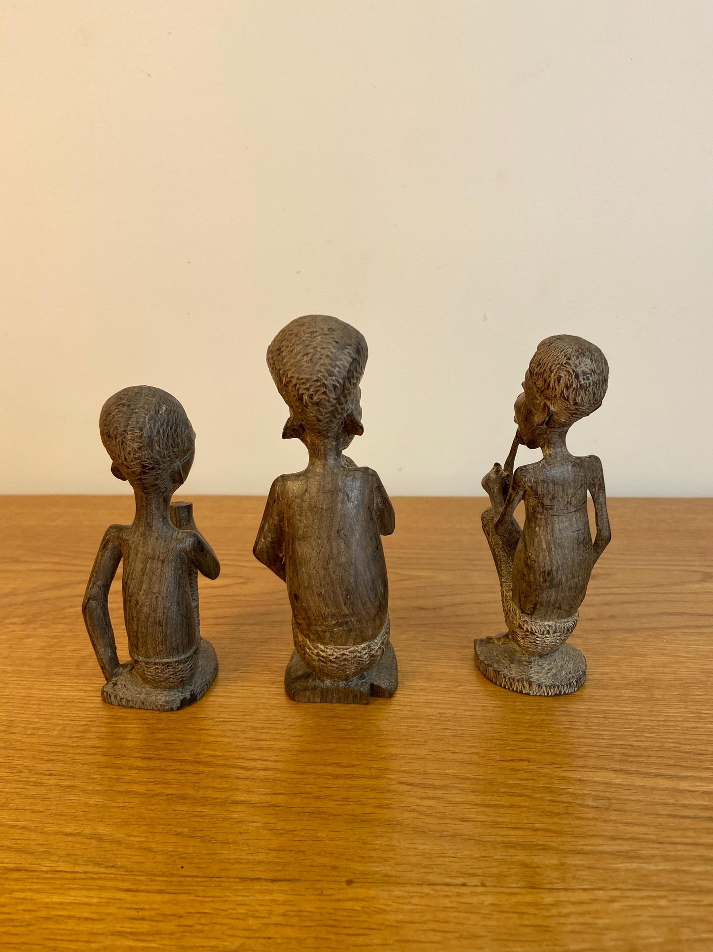 Three wonderful African carved wooden figurines, Traditional style Three Men carved out of wood
