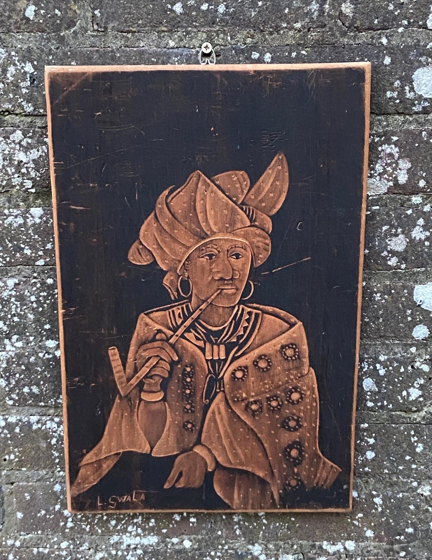 pyrography; african art; african woman in traditional dress. ethnic art. wood art.