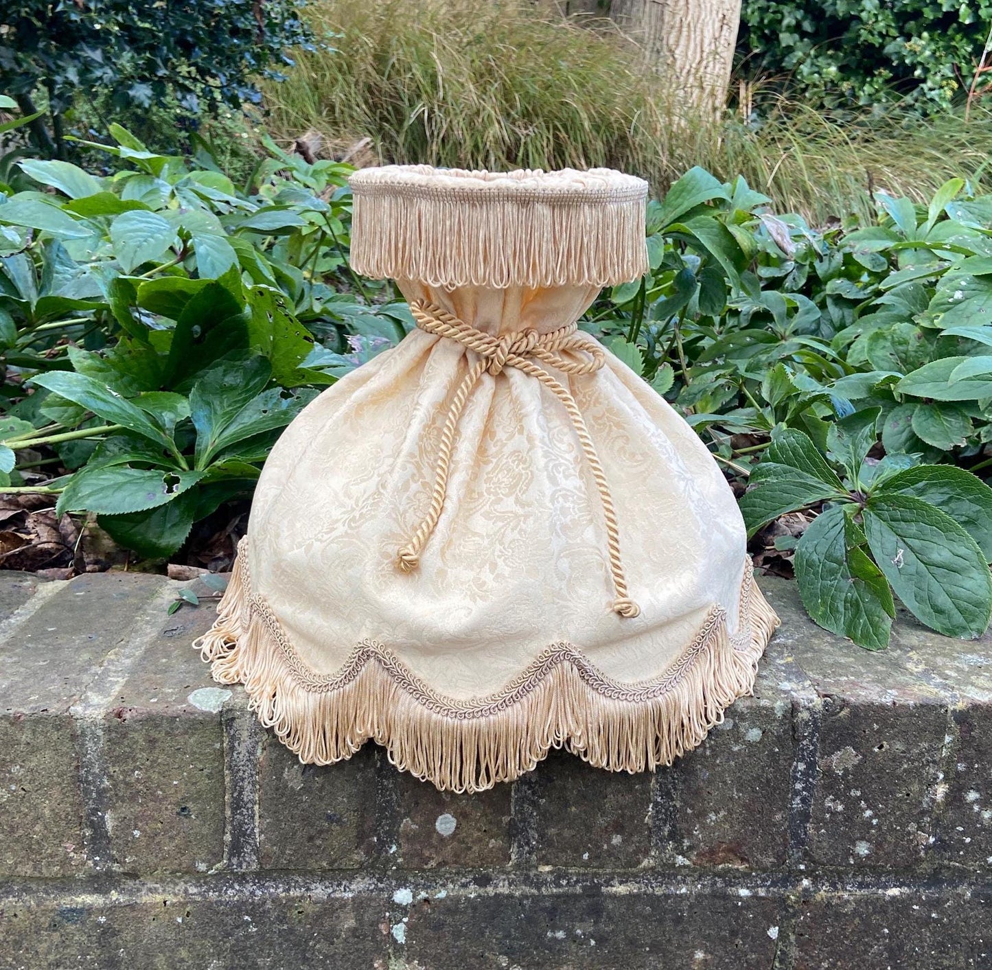 1960s retro vintage jacquard cream lamp shade, with ribbon detail and double fringe. Unique vintage shape shade.