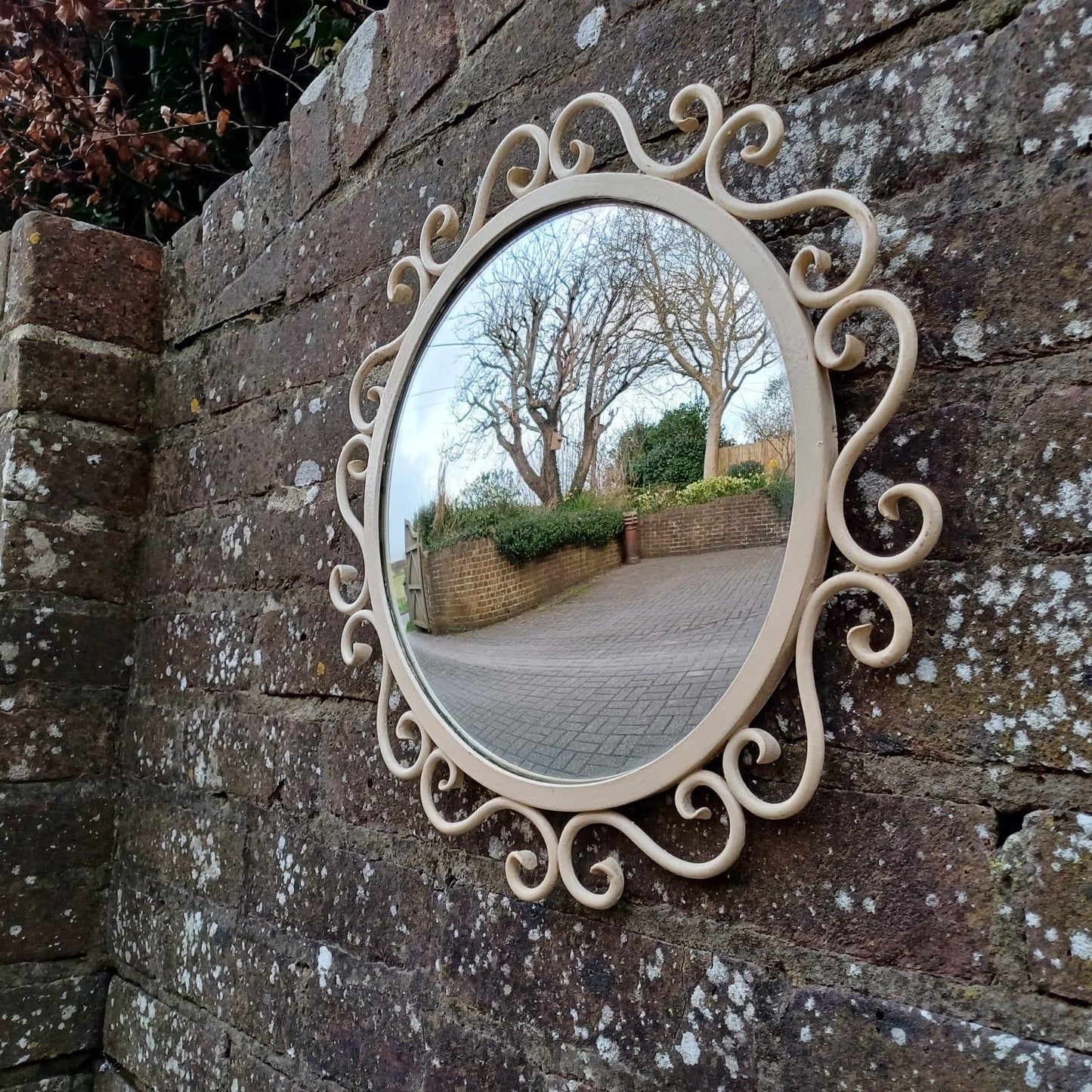 Vintage scrollwork round mirror with chain hanger and original wooden back - mid-century, French provincial revival - small wall mirror