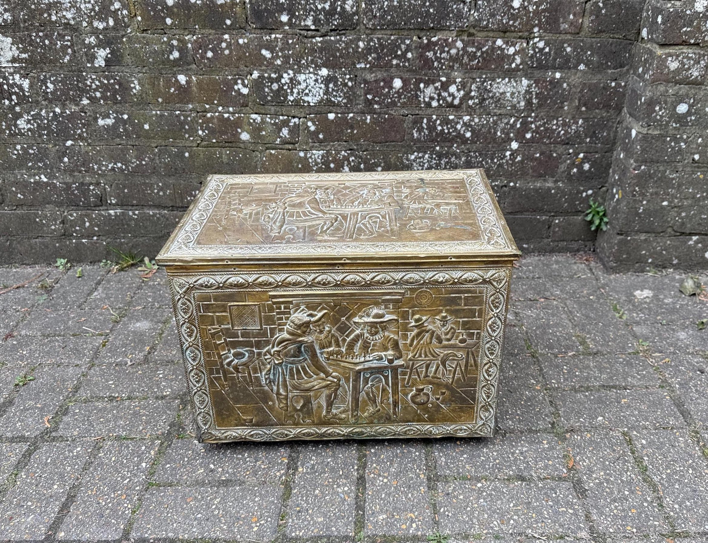mid century coal box, wooden box covered in embossed and moulded beaten brass. medieval gothic style of coal box.