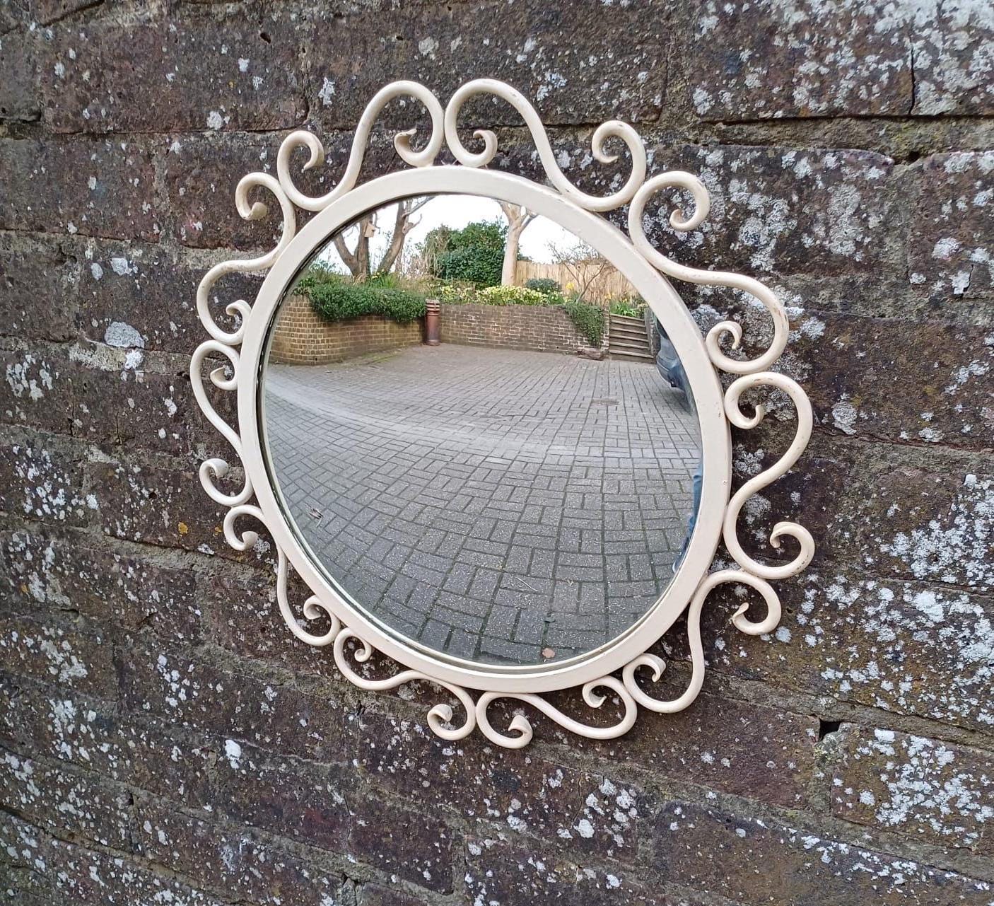 scroll work painted round mid-century mirror. VIntage retro mid-century mirror. small vintage round mirror. painted round mirror.