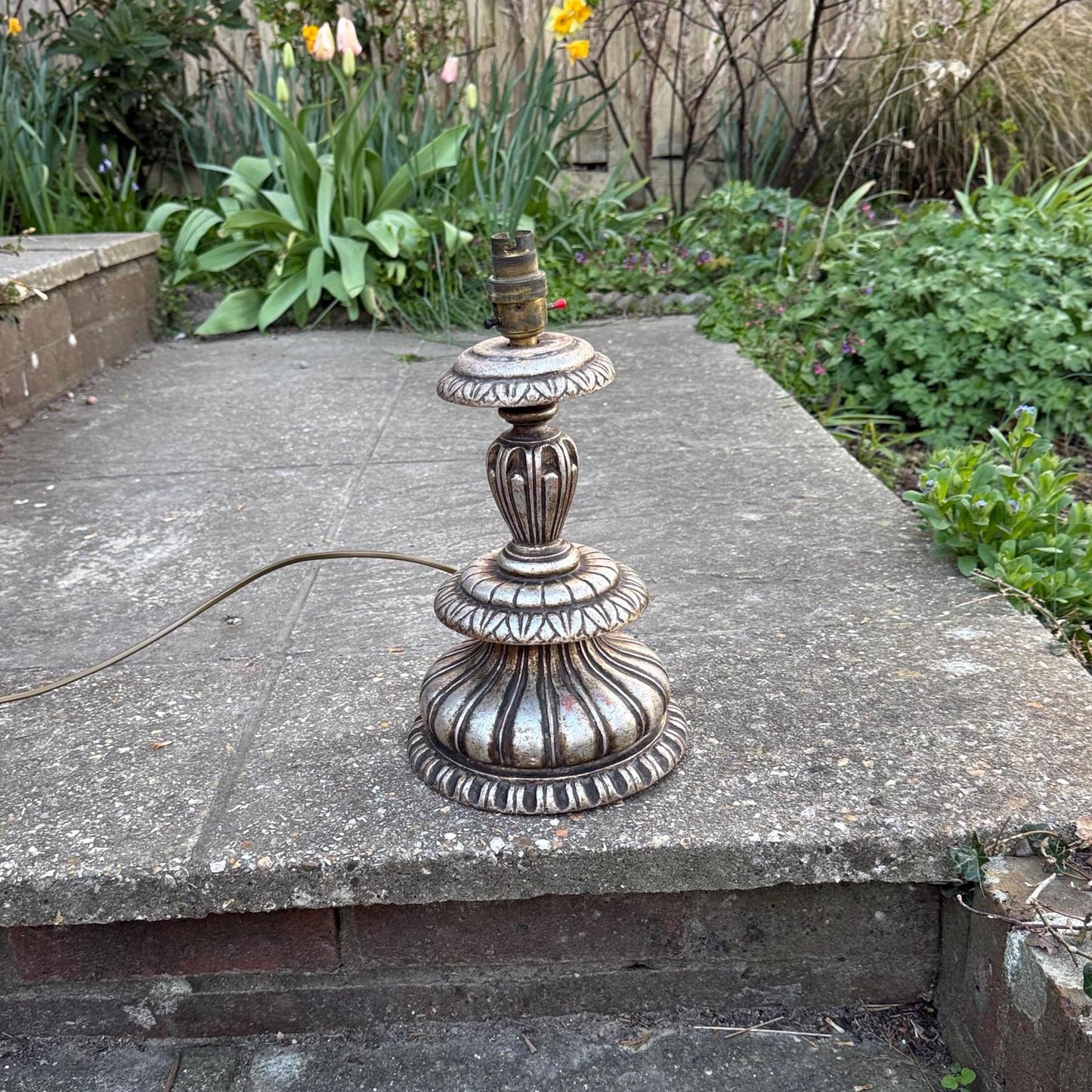 baroque style wooden carved vintage table lamp. retro period. Vintage table lamp. painted silver table lamp