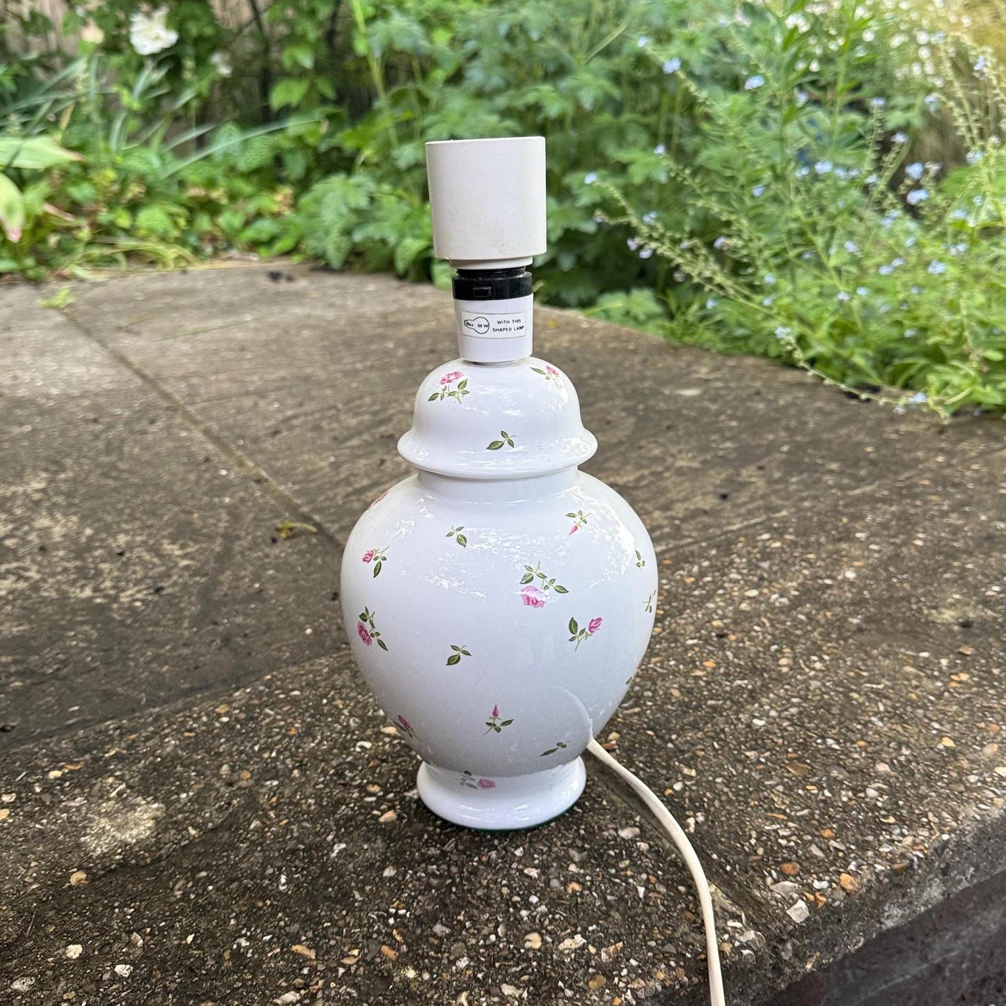 vintage china lamp. table lamp made out of white ceramic with painted pink roses and rose buds on it. made for St Michaels as shown on the underside felt base. Pretty working white ginger jar shaped lamp. Likely 1970s