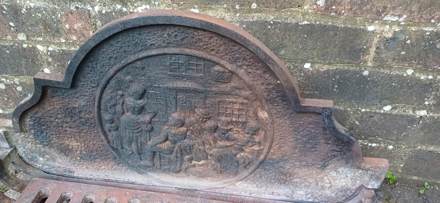 Antique Cast Iron Fire Grate with Decorative Relief Panel – Ornate 19th Century Style Fireplace Basket with Claw Feet