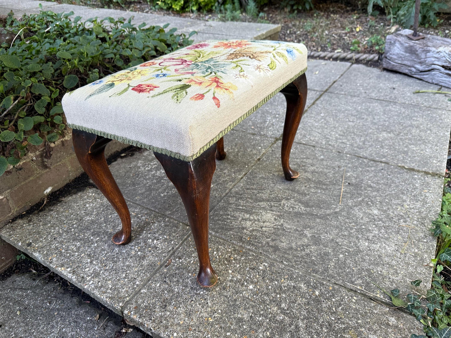 Antique footstool with floral needlepoint tapestry and Queen Anne cabriole legs – charming early 20th century vintage bench or stool