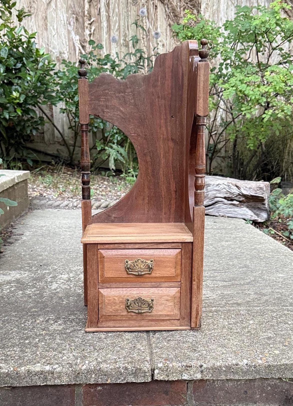 quality hardwood antique corner shelf unit - for wall hanging or sitting on a counter top. repurposed from a dressing table. lovely rustic wood with ornate carved sides, two small drawers.