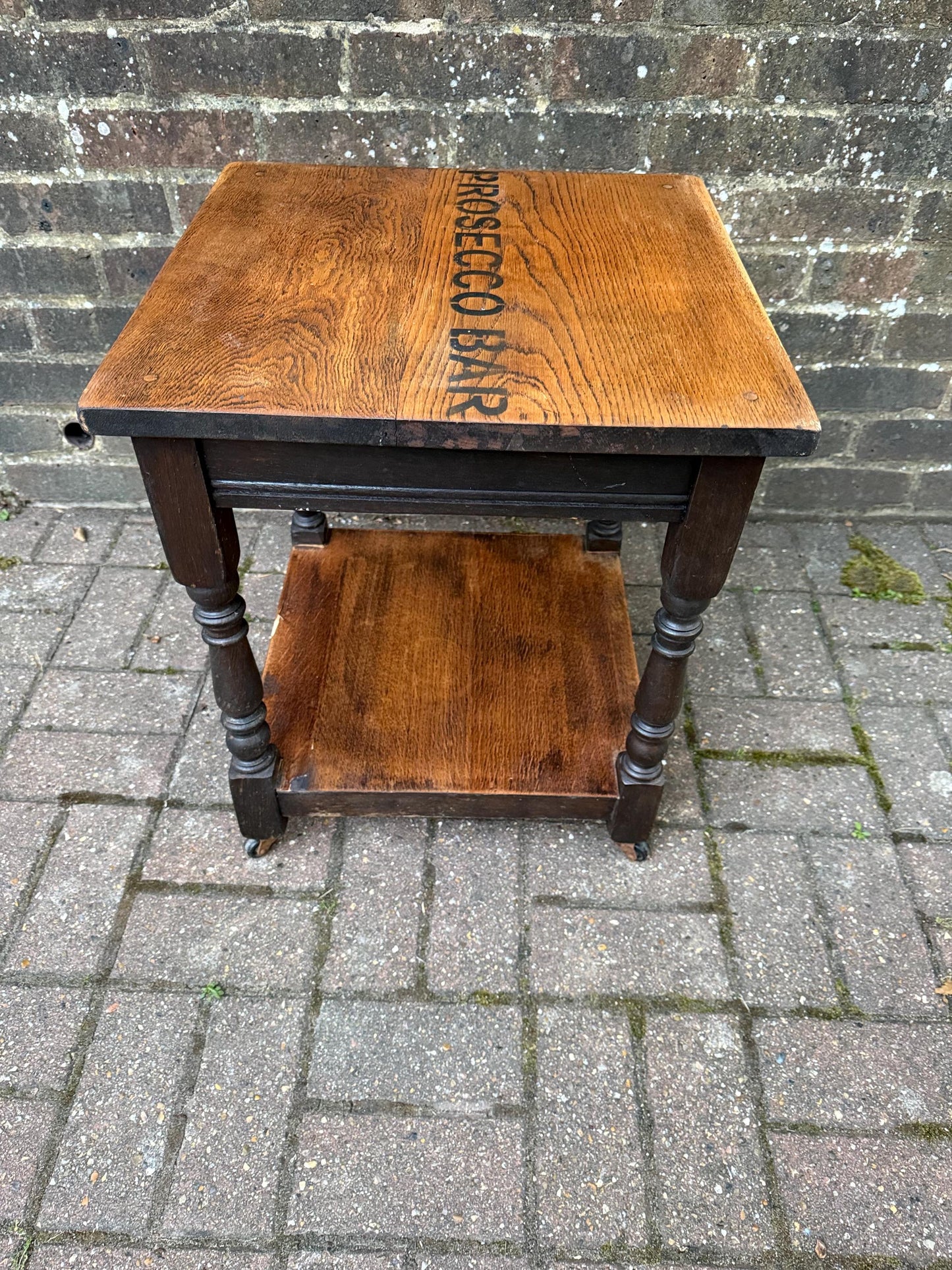 Vintage upcycled solid oak trolley / side table. Sanded and oiled top and shelf. Wheels. Prosecco Bar label. Cocktail table, Bar furniture