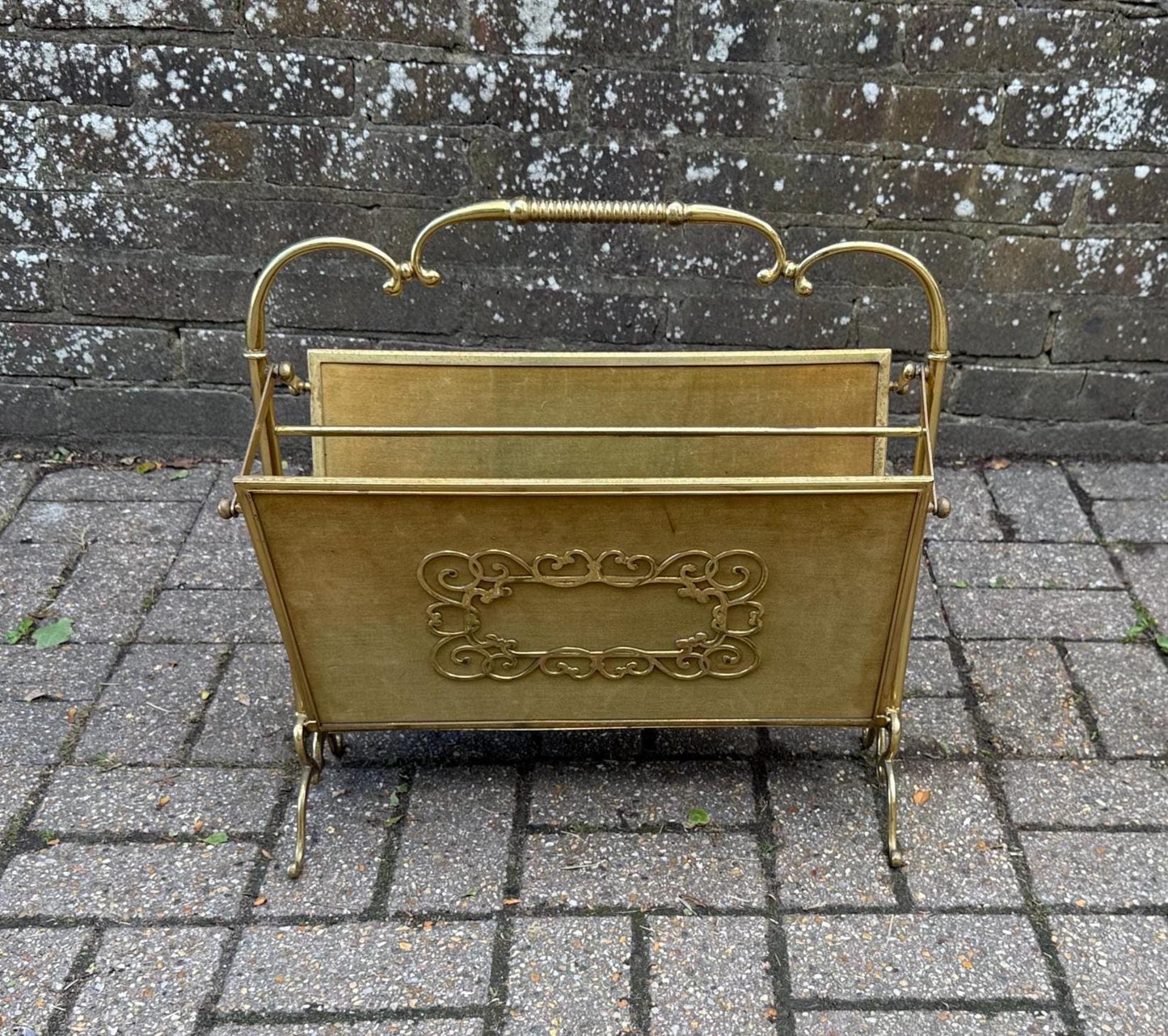 folding metal and velvet mid century rack. lovely magazine rack with gorgeous detail including a folding mechanism for easy storage and movement